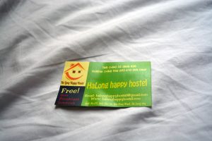 Sad business card from Ha Long Happy Hostel, Ha Long City, Vietnam